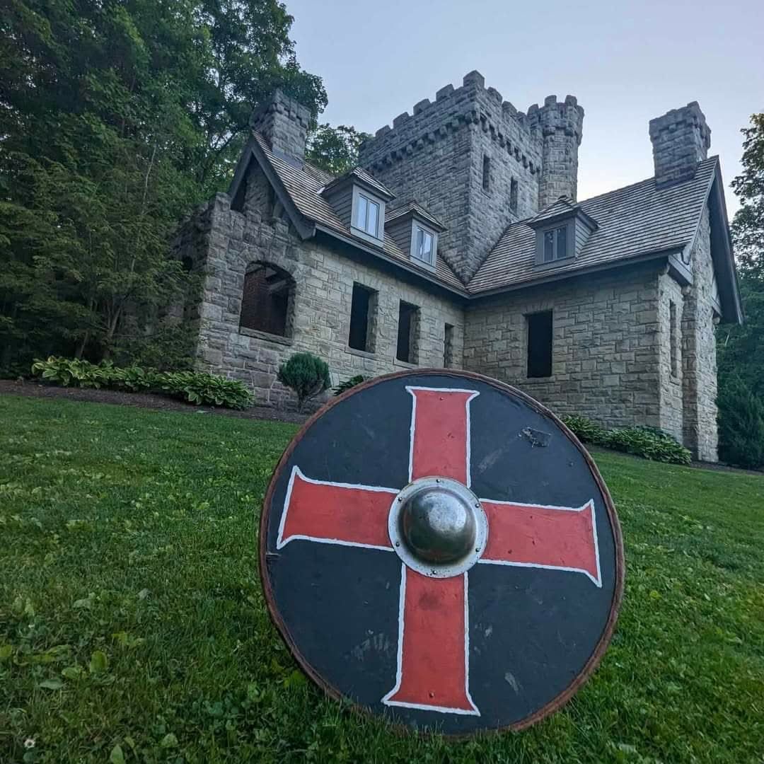 Viking shield propped against a stone castle